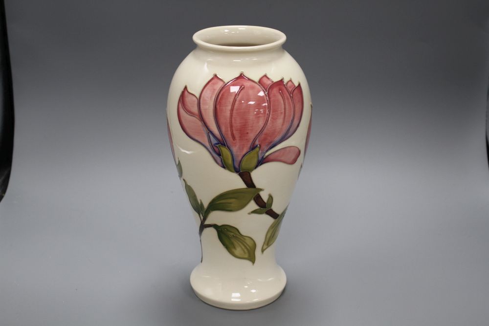 A Moorcroft magnolia pattern baluster vase, with pink flowers on a cream ground, height 31cm